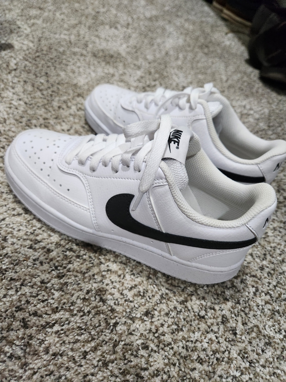 Nike White Sneakers with Black Swoosh